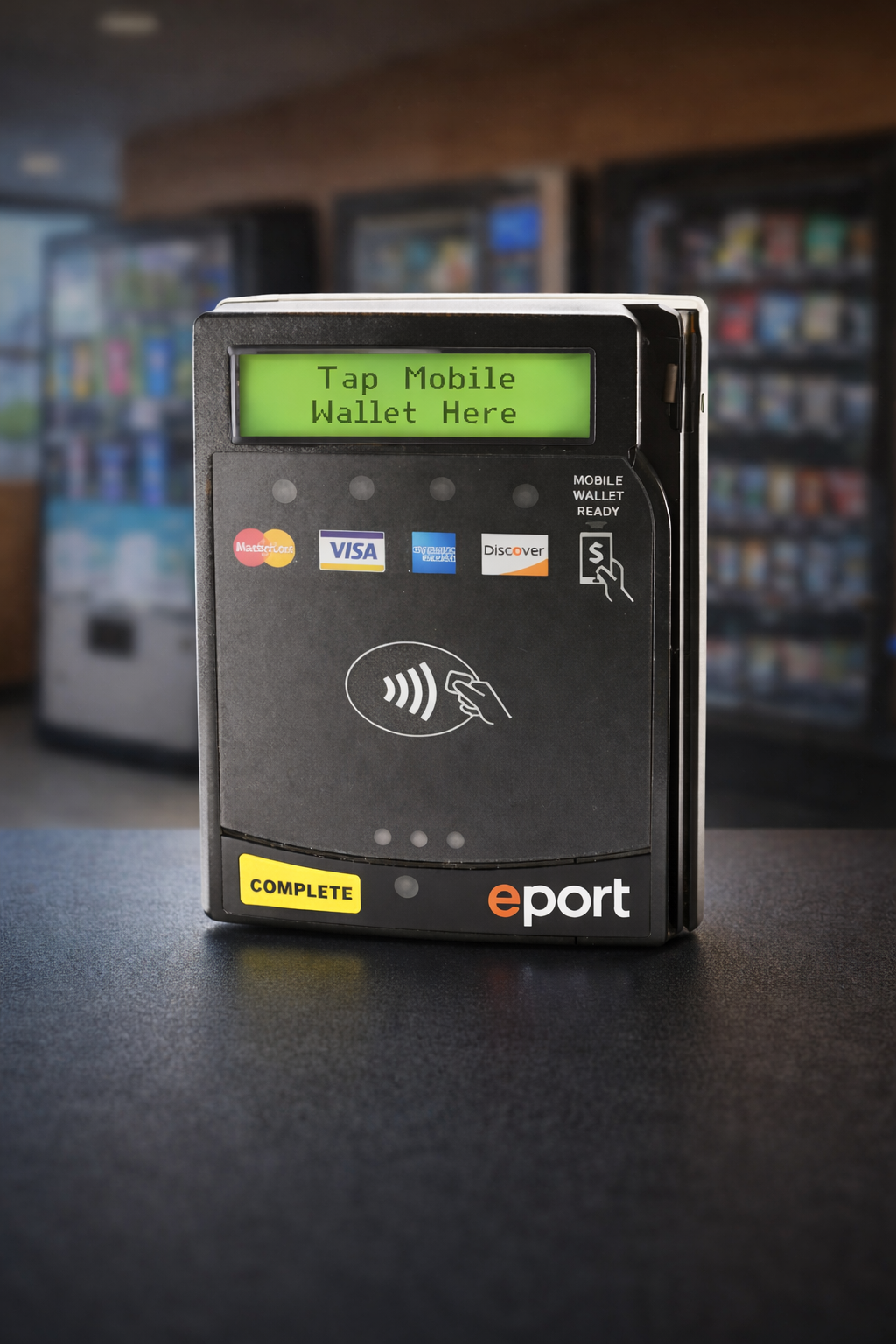 Close-up of cashless payment reader on a vending machine with tap-to-pay and mobile wallet capability.