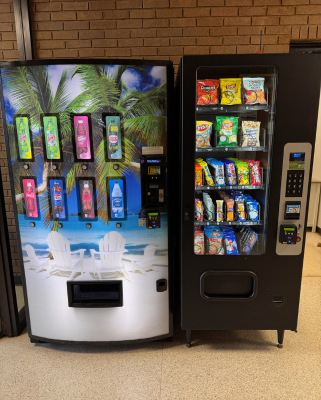 Snack and drink vending machines with cashless payment options installed in a Kentucky workplace.